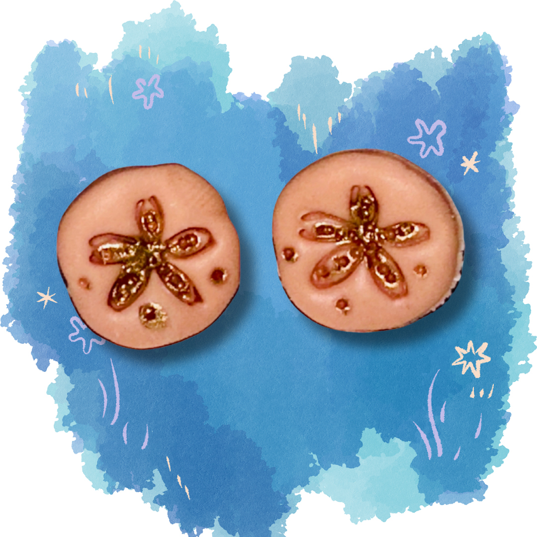 Peach colored sand dollar stud earrings crafted from polymer clay, lightweight beach-themed jewelry on a ocean blue background.