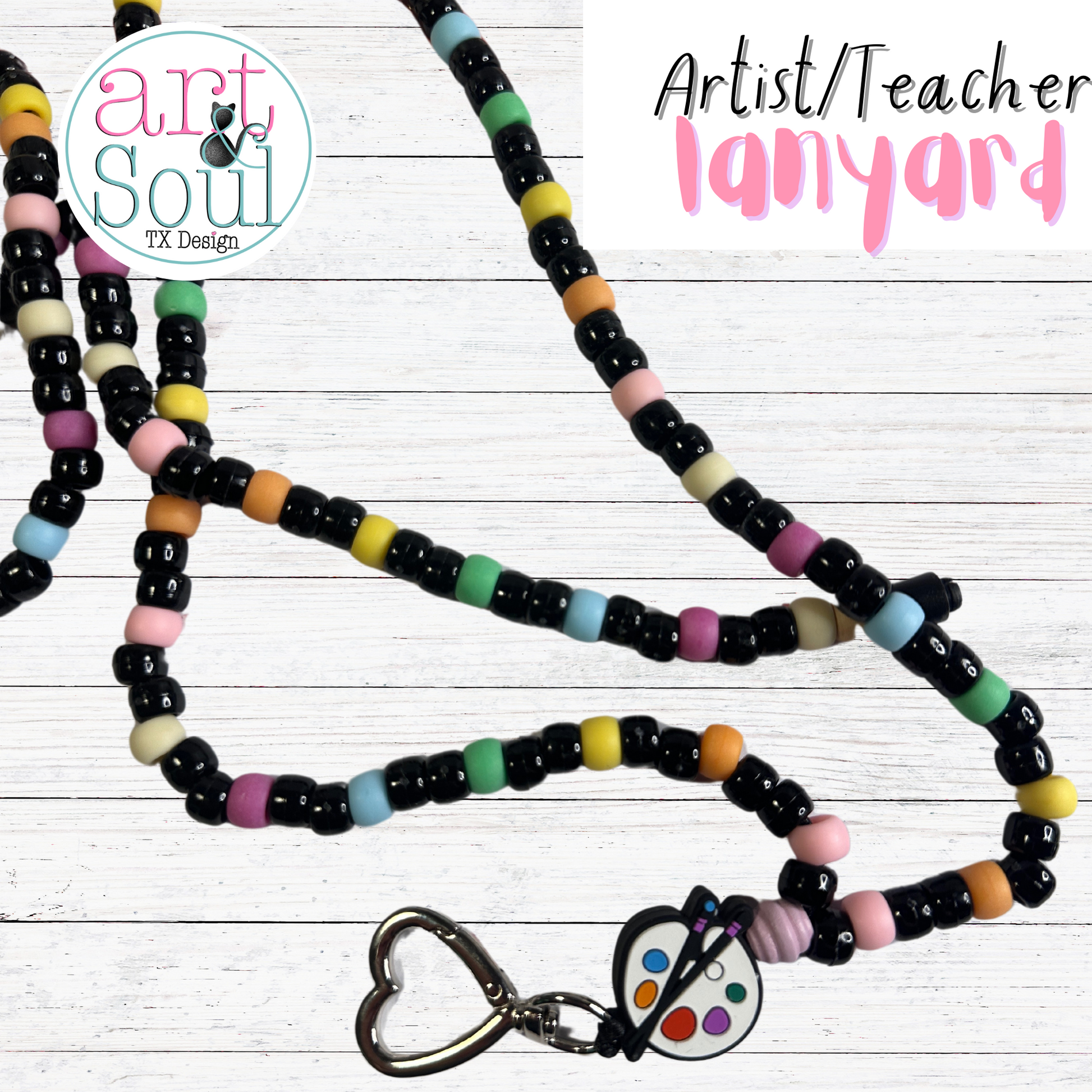 The artist/teacher lanyard zoomed to see the paint palette charm and heart-shaped metal clasp.